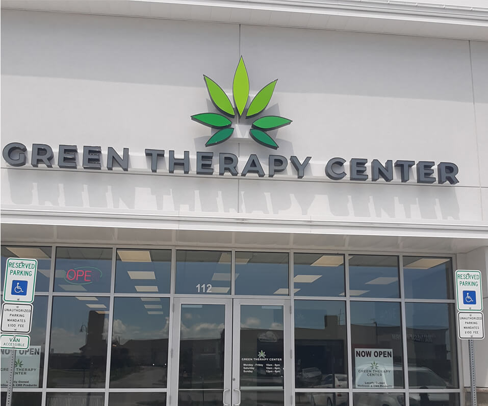 Green Therapy Center storefront channel letters with multiple color custom shaped logo